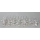 A SET OF SIXTEEN VICTORIAN GLASS GOBLETS, the plain cylindrical bowls on dumb-bell stems and