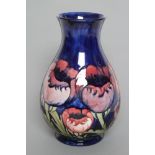 A MOORCROFT POTTERY VASE, mid 20th century, of baluster form, tubelined and painted in typical