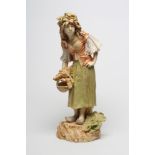 AN AMPHORA FIGURE, early 20th century, of a young Dutch girl wearing a wreath of oak leaves,