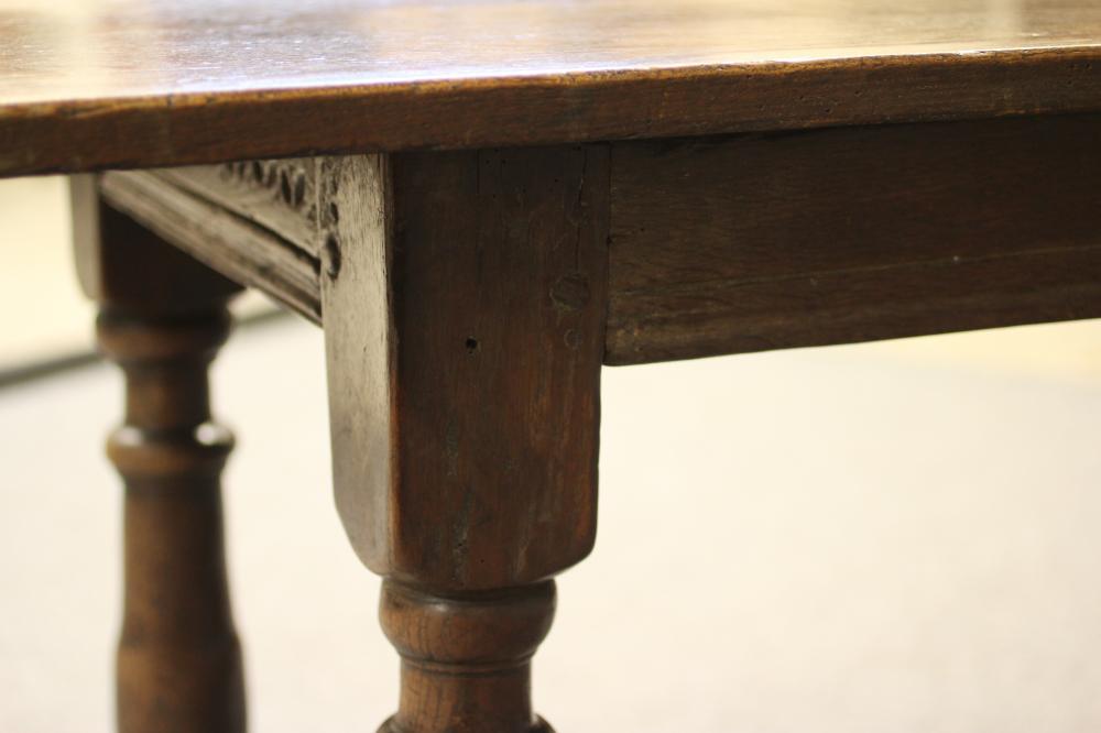 A JOINED OAK DINING TABLE, late 17th century and later, the associated three plank top on moulded - Image 4 of 4