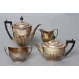 AN EDWARDIAN SILVER FOUR PIECE TEA AND COFFEE SERVICE, maker Goldsmiths & Silversmiths Co. Ltd.,