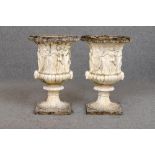 A LARGE PAIR OF COMPOSITION STONE MEDICI STYLE URNS, the ovolo rim over frieze of classical figures,