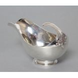 AN ART DECO SILVER SAUCEBOAT, maker Blankensee & Son Ltd., Birmingham 1937, the exaggerated oval