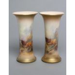 A PAIR OF ROYAL WORCESTER CHINA VASES, c.1921, of waisted cylindrical form, painted in polychrome