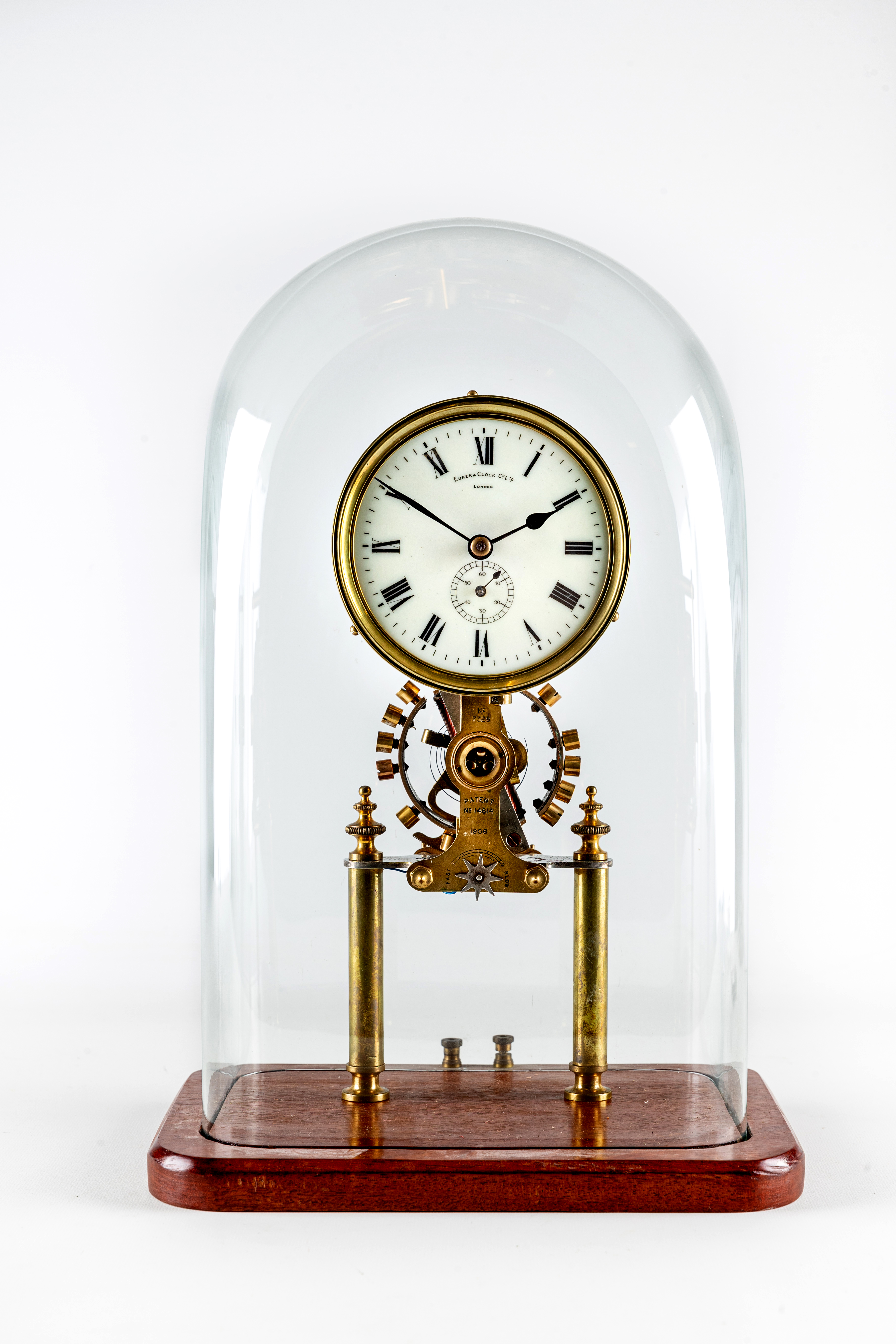 AN ENGLISH BRASS ELECTRIC TABLE CLOCK by Eureka Clock Company, 20th century, No. 7328 Patent No.