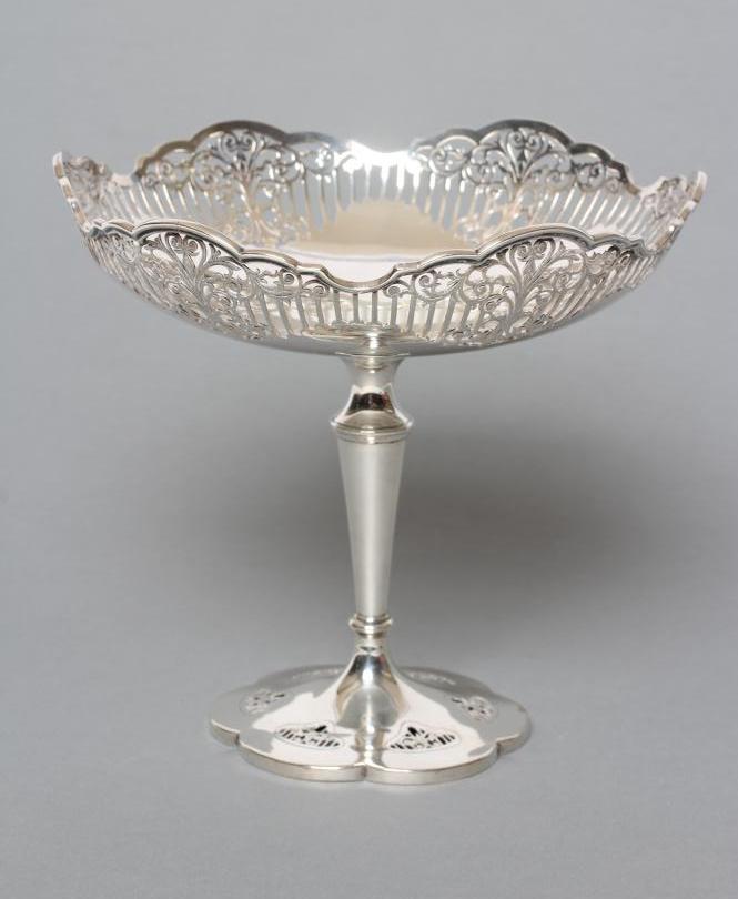 A HIGH PEDESTAL SILVER TAZZA, maker Adie Bros., Sheffield 1912, the shallow dished bowl with pierced