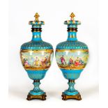 A PAIR OF FRENCH PORCELAIN GARNITURE VASES AND COVERS, mid 19th century, of ovoid form with fluted