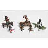 SIX VIENNA TYPE COLD PAINTED BRONZE MINIATURES, comprising a boy seated astride a crocodile, 2 1/