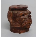 A "BLACK FOREST" CARVED WOOD TOBACCO JAR modelled as a smoking dog's head with glass eyes and hinged