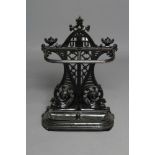 A VICTORIAN CAST IRON STICK STAND of rounded oblong form, the trellis pierced and waisted back