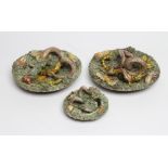 THREE JOSE A. CUNHA CALDAS RAINHA MAJOLICA PLAQUES, late 19th century, each of dished circular form,