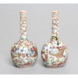 A PAIR OF CHINESE PORCELAIN BOTTLE VASES painted in underglaze blue with a dragon chasing the