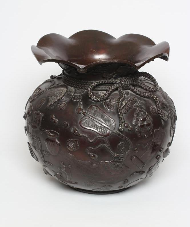 A LARGE JAPANESE BRONZED METAL VASE, modern, of squat circular form, the wide everted frilled rim