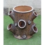 A VICTORIAN EARTHENWARE STRAWBERRY PLANTER, modelled as a tree trunk, 14 1/2" x 21 1/2"