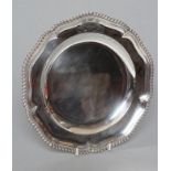A LATE VICTORIAN SILVER PLATE, maker James Garrard, London 1888, of shaped circular form, the