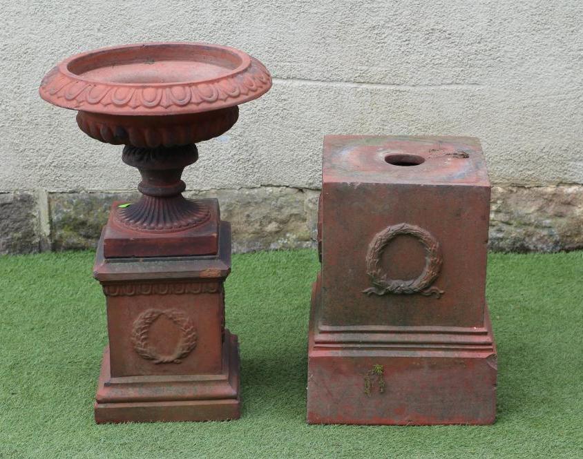 A VICTORIAN TERRACOTTA URN, the shallow fluted bowl with ovolo moulded rim, on fluted socle and