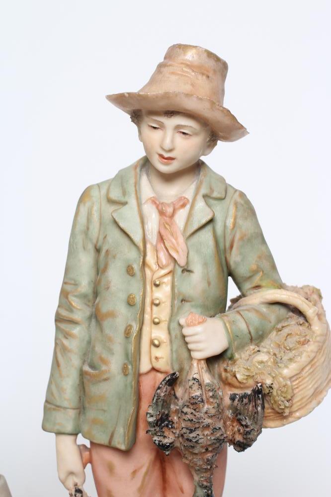 A PAIR OF ROYAL DUX FIGURES, early 20th century, modelled as a young hunter with a basket over his - Image 3 of 4