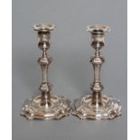 A PAIR OF GEORGE II STYLE SILVER CANDLESTICKS, maker Goldsmiths & Silversmiths Co. Ltd., London