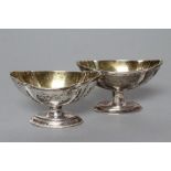 A PAIR OF GEORGE III SILVER PEDESTAL SALTS, maker's mark rubbed (W?), London 1786, of lobed oval