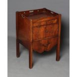 A GEORGIAN MAHOGANY BEDSIDE COMMODE, late 18th century, the part wave edged and pierced top over