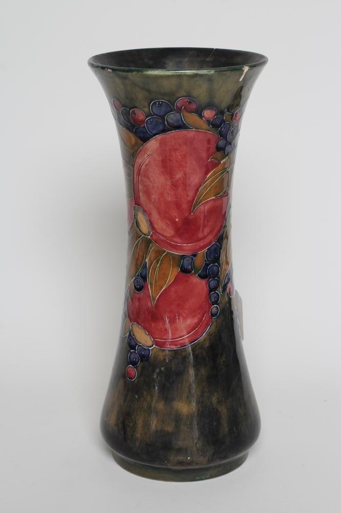 A MOORCROFT POTTERY VASE, c.1915, of tall waisted cylindrical form tubelined and painted in