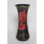 A MOORCROFT POTTERY VASE, c.1915, of tall waisted cylindrical form tubelined and painted in