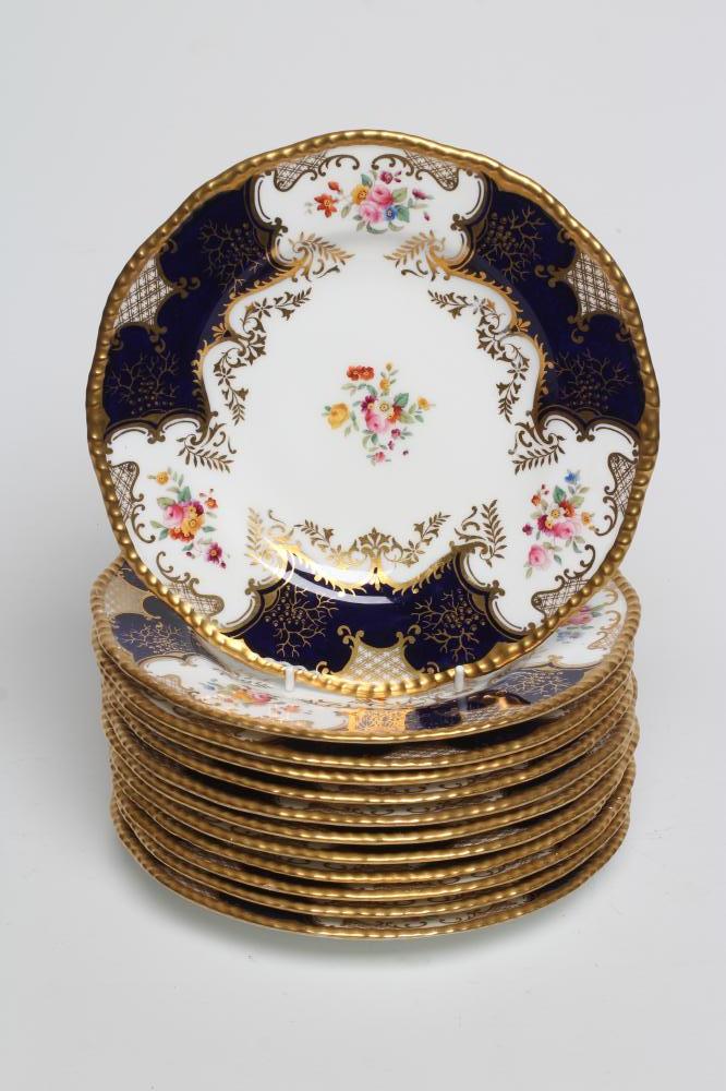 A SET OF TWELVE COALPORT CHINA DESSERT PLATES, early 20th century, printed and painted with the "