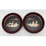 A PAIR OF JAPANESE LACQUER PLAQUES, Meiji period, of dished circular form, with bone and mother of