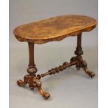 A VICTORIAN WALNUT OCCASIONAL TABLE, the quarter veneered burr oval top and waved frieze raised on