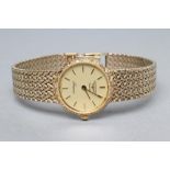 A LADY'S 9CT GOLD LONGINES WRISTWATCH, the gilt dial with applied batons and inscribed "Presence",