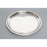 A SALVER, maker Joseph Gloster, Birmingham 1931, of plain circular form raised upon three cast paw