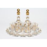 A FRENCH GLASS LIQUEUR SET, 19th century, comprising pair of mallet decanters with globular stoppers