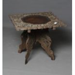 AN INDIAN CARVED HARDWOOD OCCASIONAL TABLE, 19th century, the square edged lift off top with central