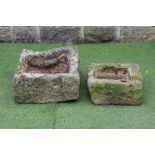 A SANDSTONE SMALL TROUGH of irregular rough hewn oblong form, 20" x 21" x 10", together with a