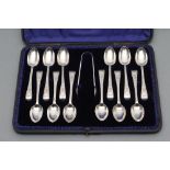 A SET OF TWELVE LATE VICTORIAN TEASPOONS, maker G M Jackson, London 1895, with bright cut