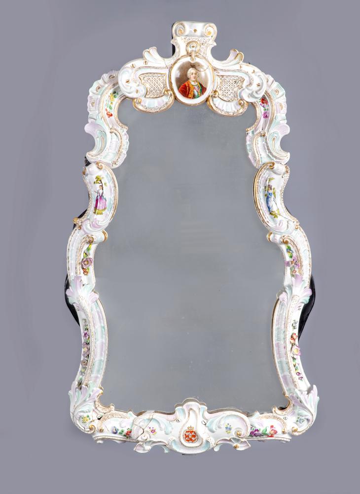 A LARGE GERMAN PORCELAIN MIRROR FRAME, mid 19th century, the typical rococo scrolls encrusted with