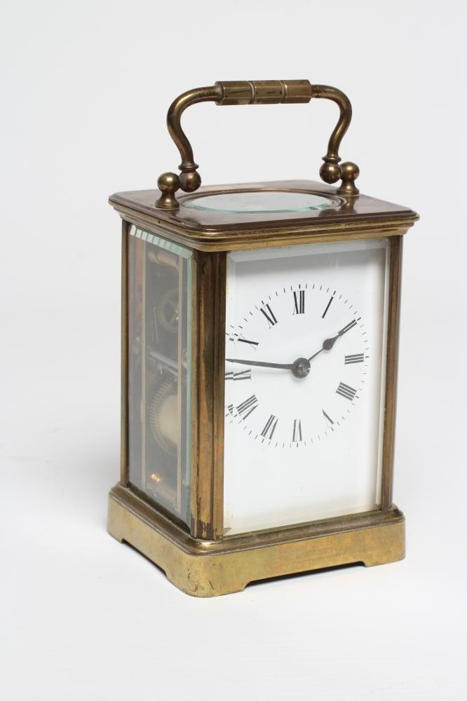 A BRASS CASED CARRIAGE CLOCK, the twin barrel movement with platform escapement striking on a