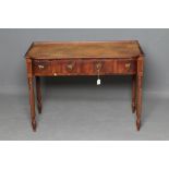 A REGENCY MAHOGANY DRESSING TABLE of mildly bowed oblong form, the galleried moulded edged top