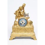 A FRENCH GILT METAL AND SILVERED MANTEL CLOCK, the twin barrel movement striking on a bell and