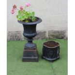 A VICTORIAN CAST IRON URN, of fluted campana form with egg and dart moulded rim, raised on