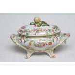 A LARGE ST AMAND ET HAMAGE FAIENCE TUREEN AND COVER, early 20th century, of lobed oval form with two