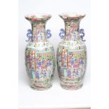 A PAIR OF CANTONESE PORCELAIN VASES of cylindrical form with waisted necks and scroll pierced