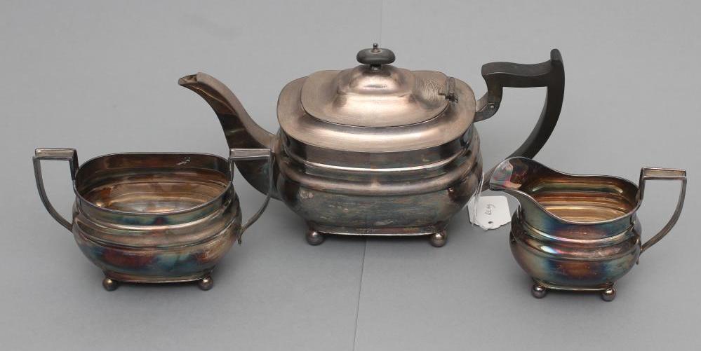 A THREE PIECE TEA SERVICE, maker Hutton & Sons, Birmingham 1932, of plain rounded oblong form raised