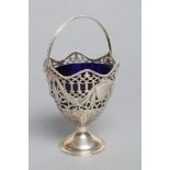 A LATE VICTORIAN SUGAR BASKET, maker Charles Stuart Harris, London 1892, with bead cast overhead