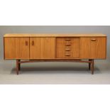 A G PLAN TEAK LOW SIDEBOARD, 1960's, of oblong form with three central drawers, one fitted for