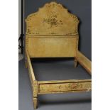 A FRENCH PAINTED PINE SINGLE BEDSTEAD, early 20th century, the arched headboard painted with a