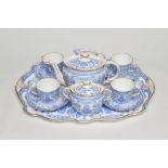 A ROYAL CROWN DERBY CHINA CABARET SET, 1896, printed in bright blue with finches perched upon scroll