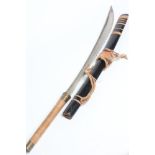A CHINESE SWORD, with 22 1/4" curved blade, brass grip, plaited reed grip and wooden scabbard, 33