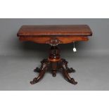 A VICTORIAN ROSEWOOD FOLDING CARD TABLE, the rounded oblong swivel top opening to a circular