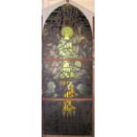 A VICTORIAN ECCLESIASTICAL PAINTED AND STAINED GLASS PANEL, of arched leaded form painted in the